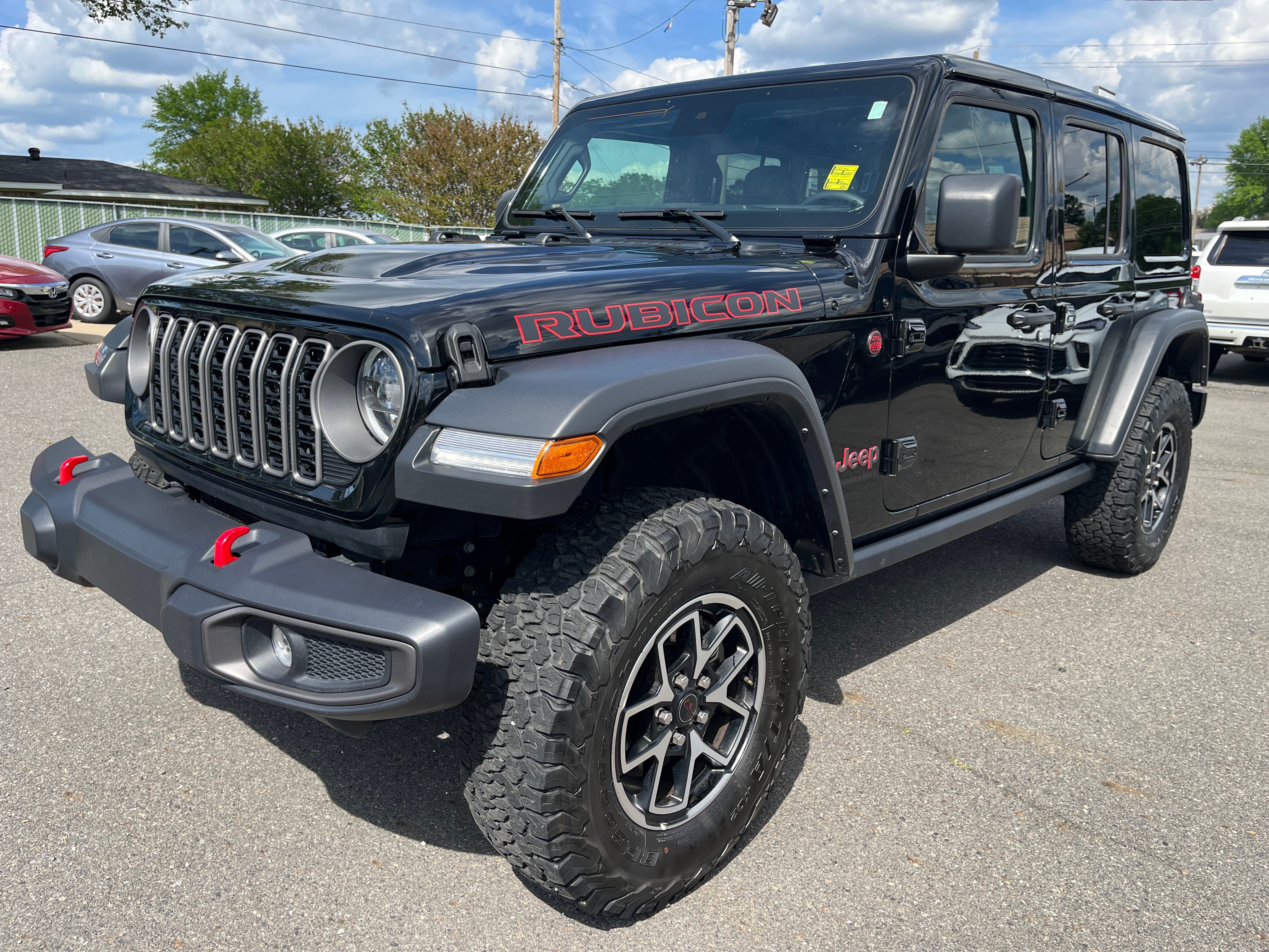 2025 Jeep Wrangler Rubicon in Black — front three-quarter view