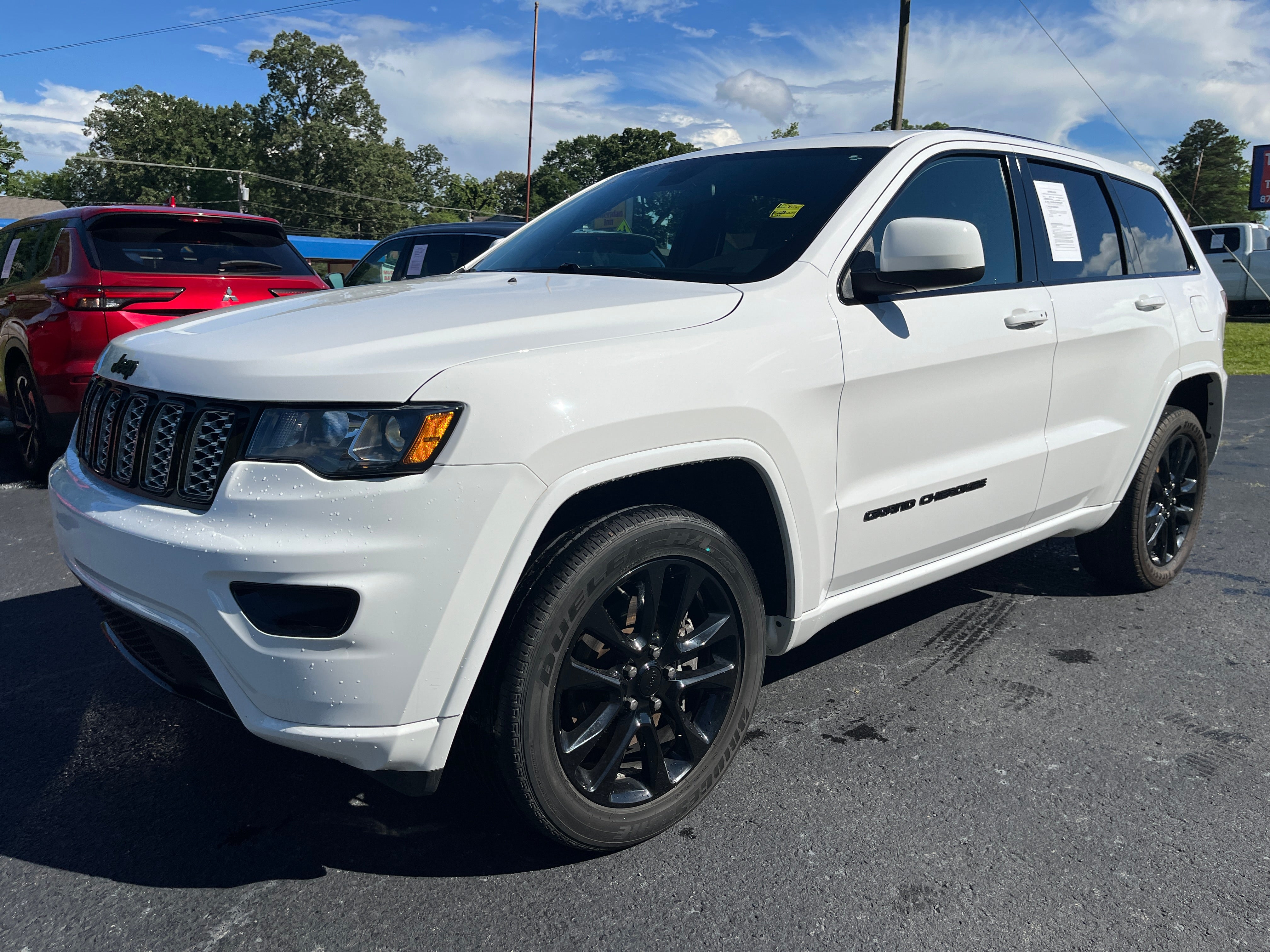 2021 Jeep Grand Cherokee Laredo X in White — front three-quarter view