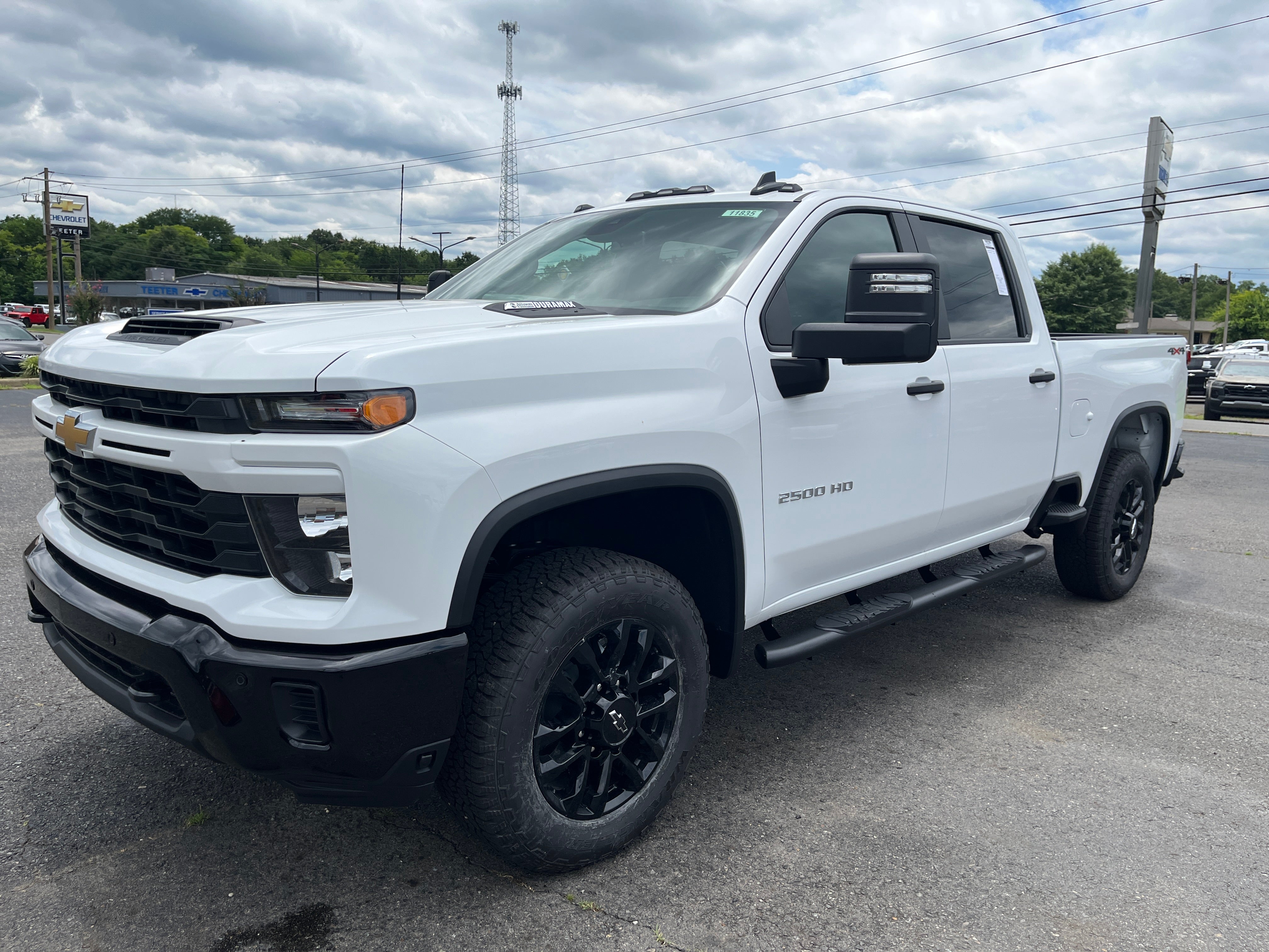 2026 Chevrolet Silverado 2500 HD Custom in Summit White — front three-quarter view