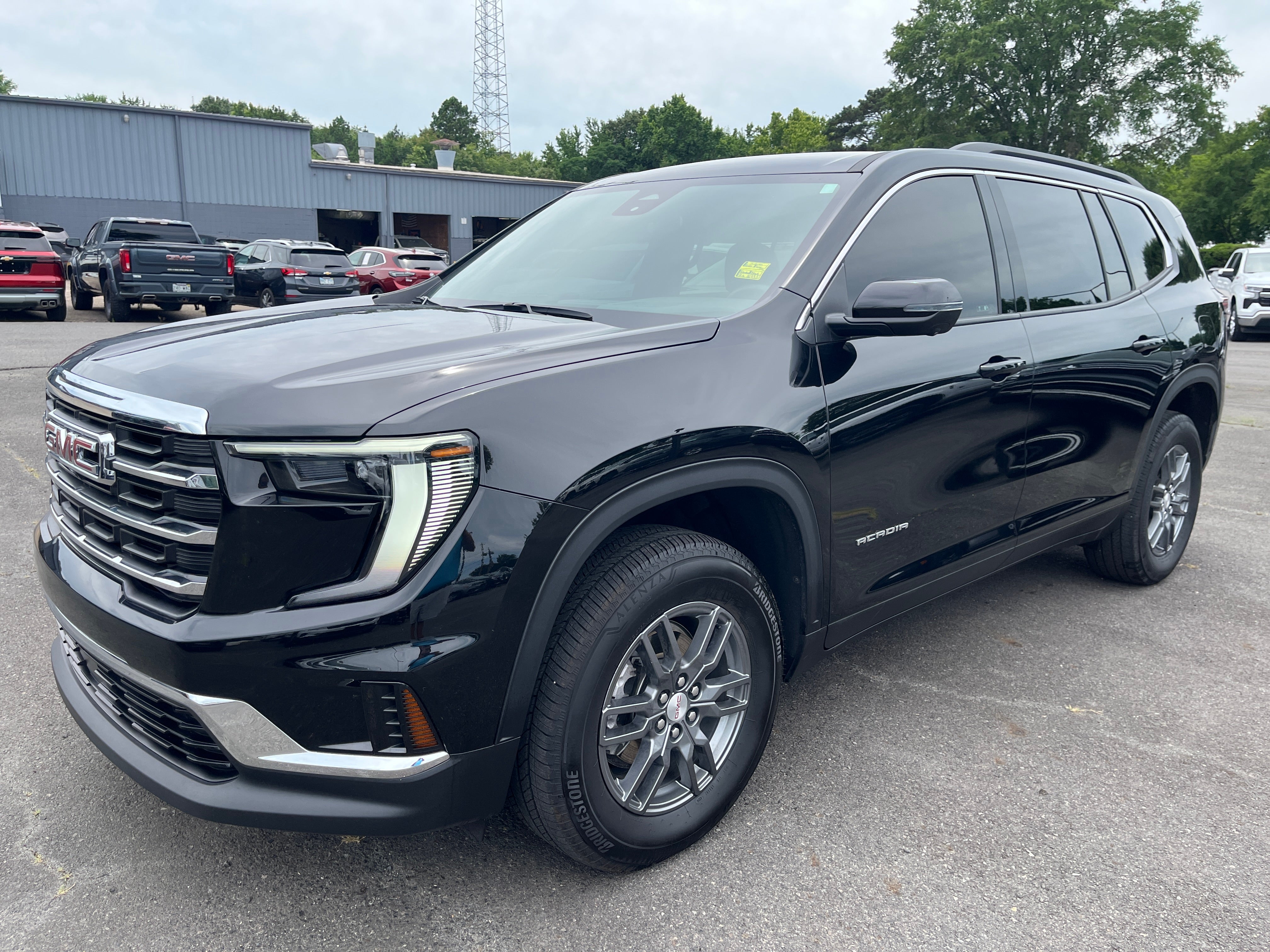 2025 GMC Acadia Elevation in Ebony Twilight Metallic — front three-quarter view
