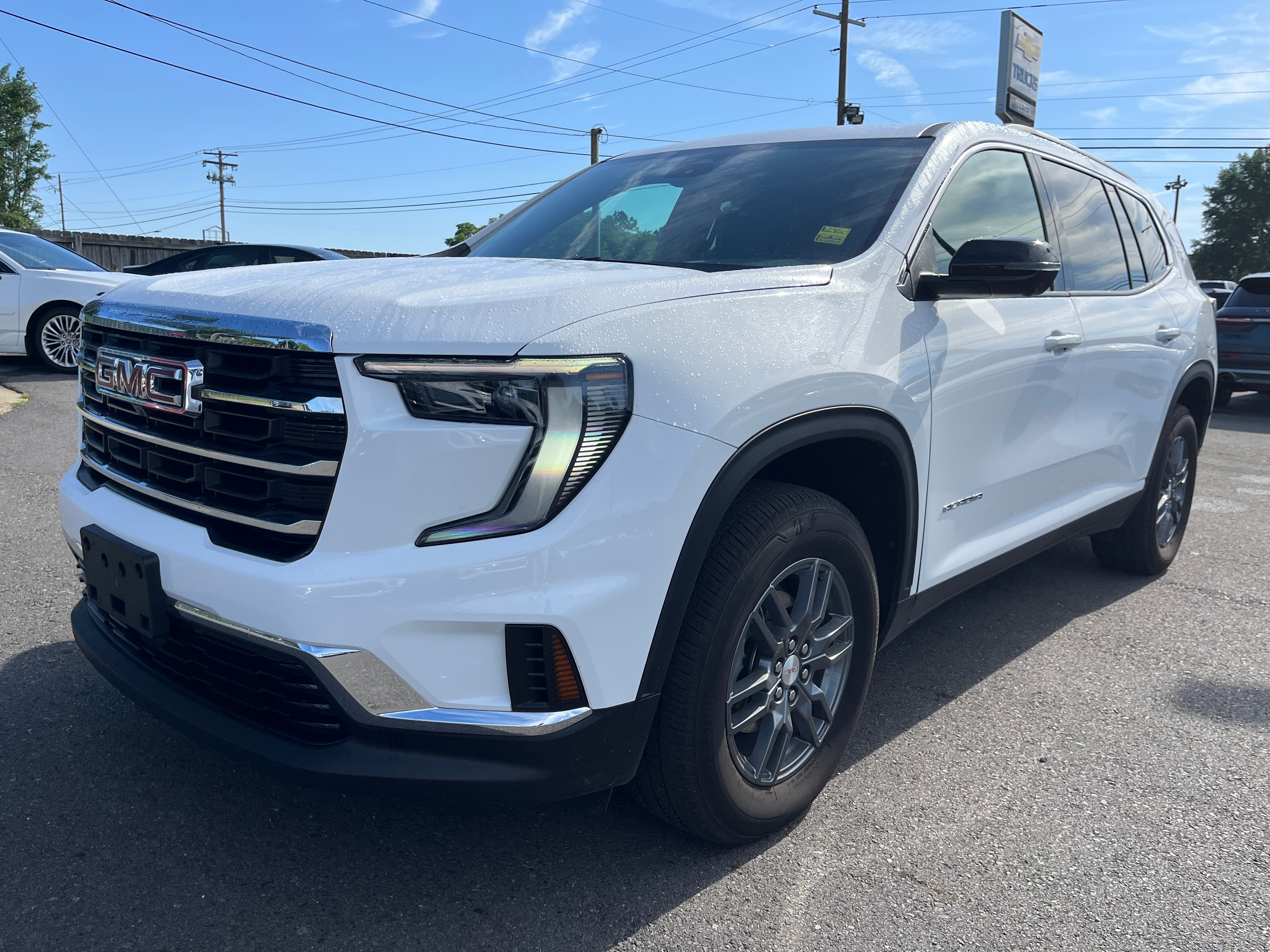 2025 GMC Acadia Elevation in Summit White — front three-quarter view