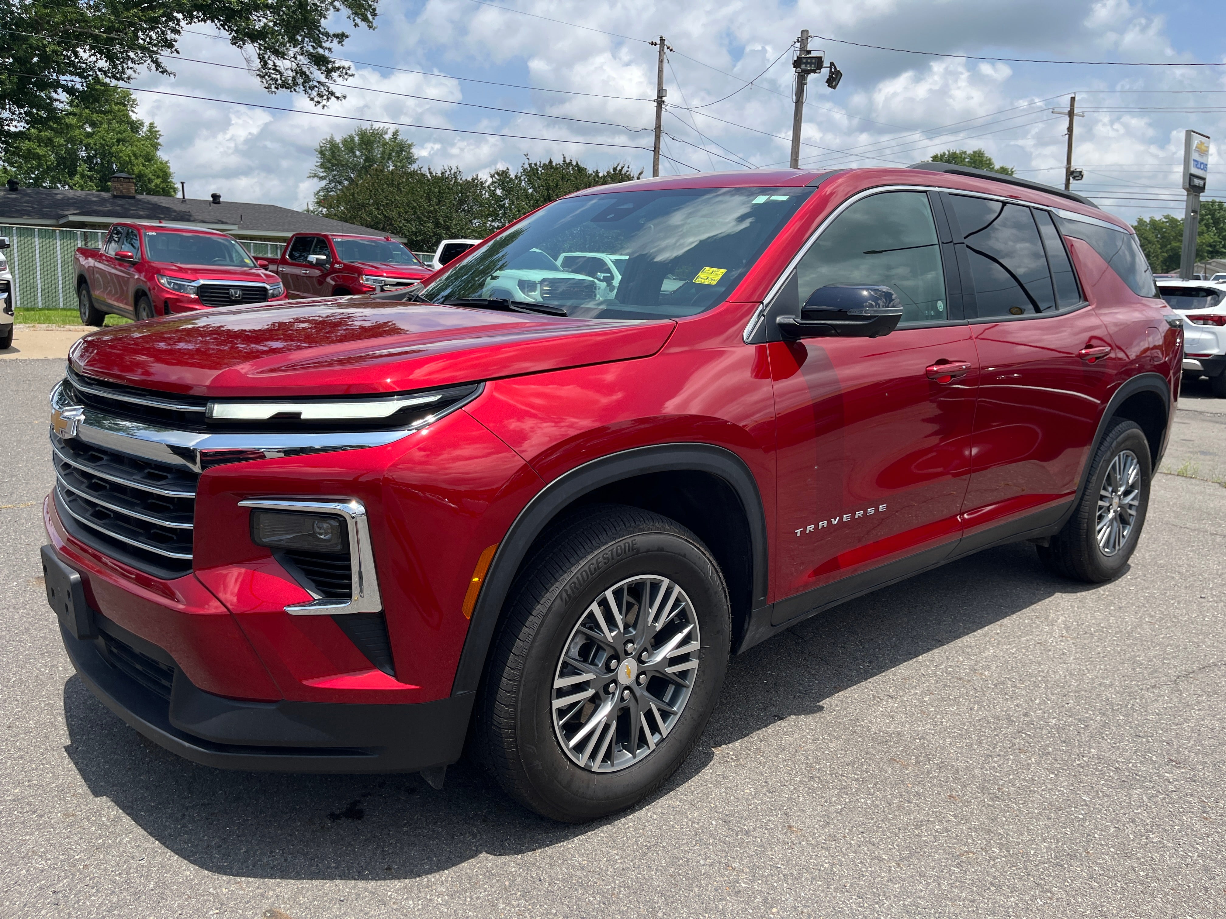2024 Chevrolet Traverse LT in Radiant Red Tintcoat — front three-quarter view