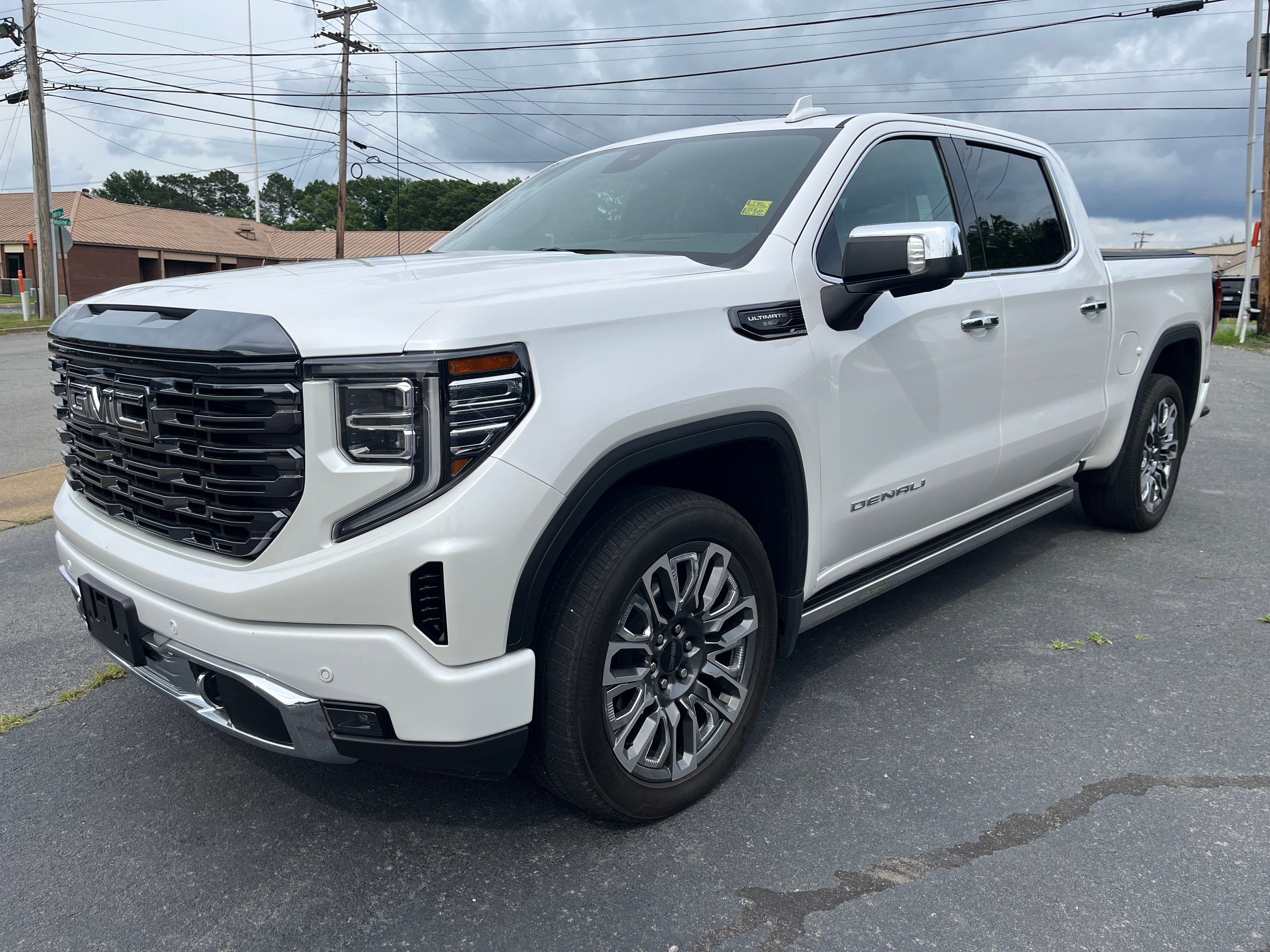 2023 GMC Sierra 1500 Denali Ultimate in White Frost Tricoat — front three-quarter view