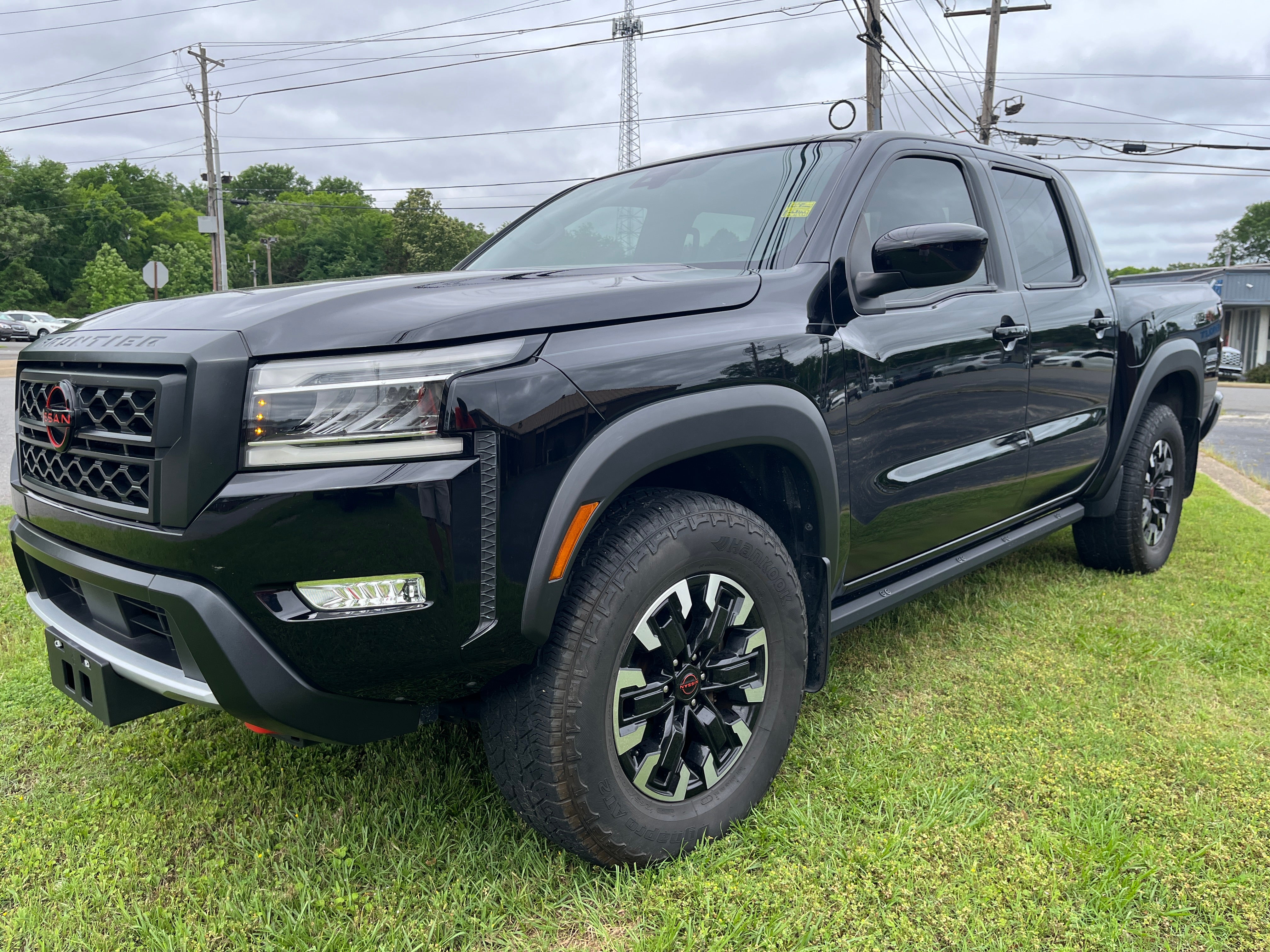 2024 Nissan Frontier PRO-4X in Black — front three-quarter view
