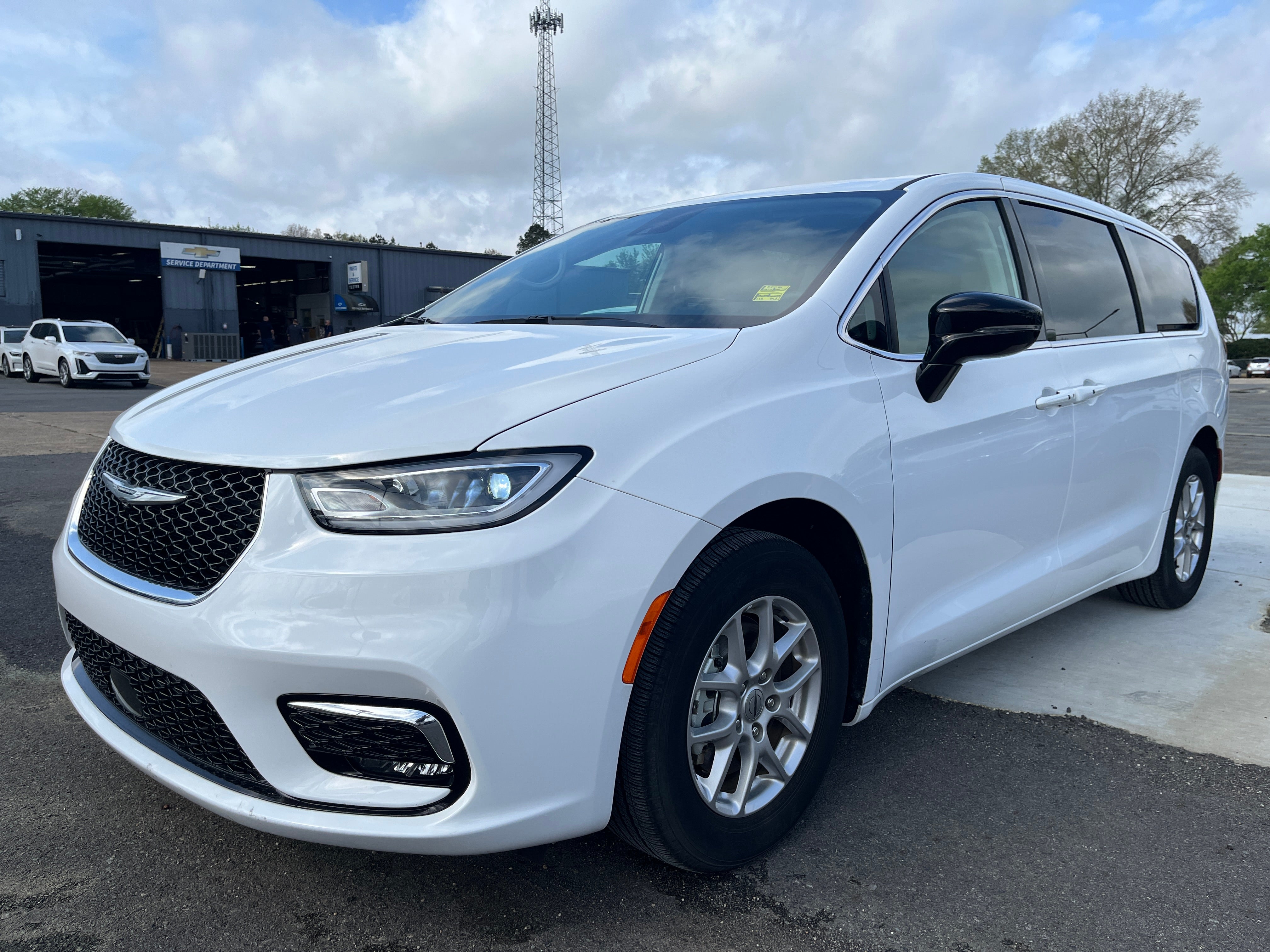 2024 Chrysler Pacifica Touring L in White — front three-quarter view