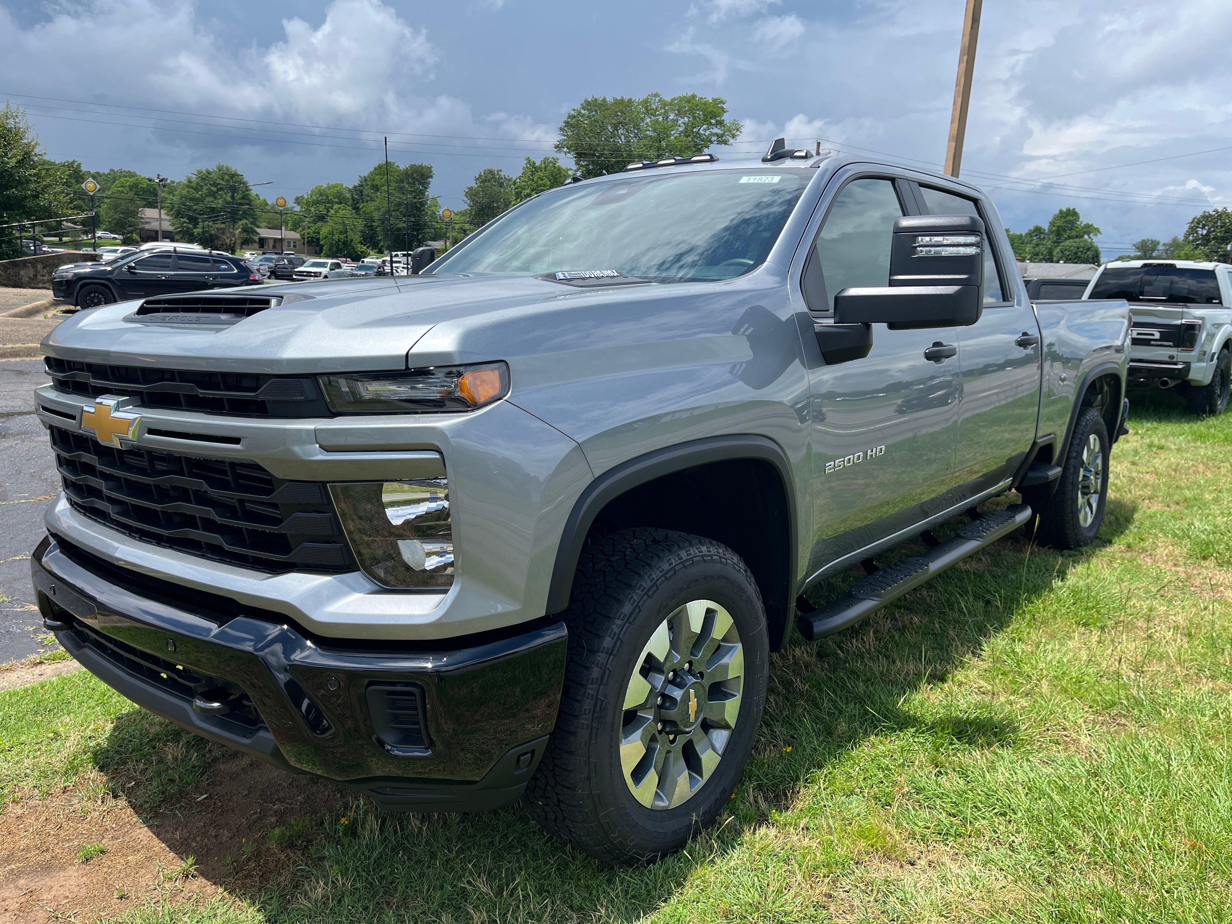 2026 Chevrolet Silverado 2500 HD Custom in Sterling Gray Metallic — front three-quarter view