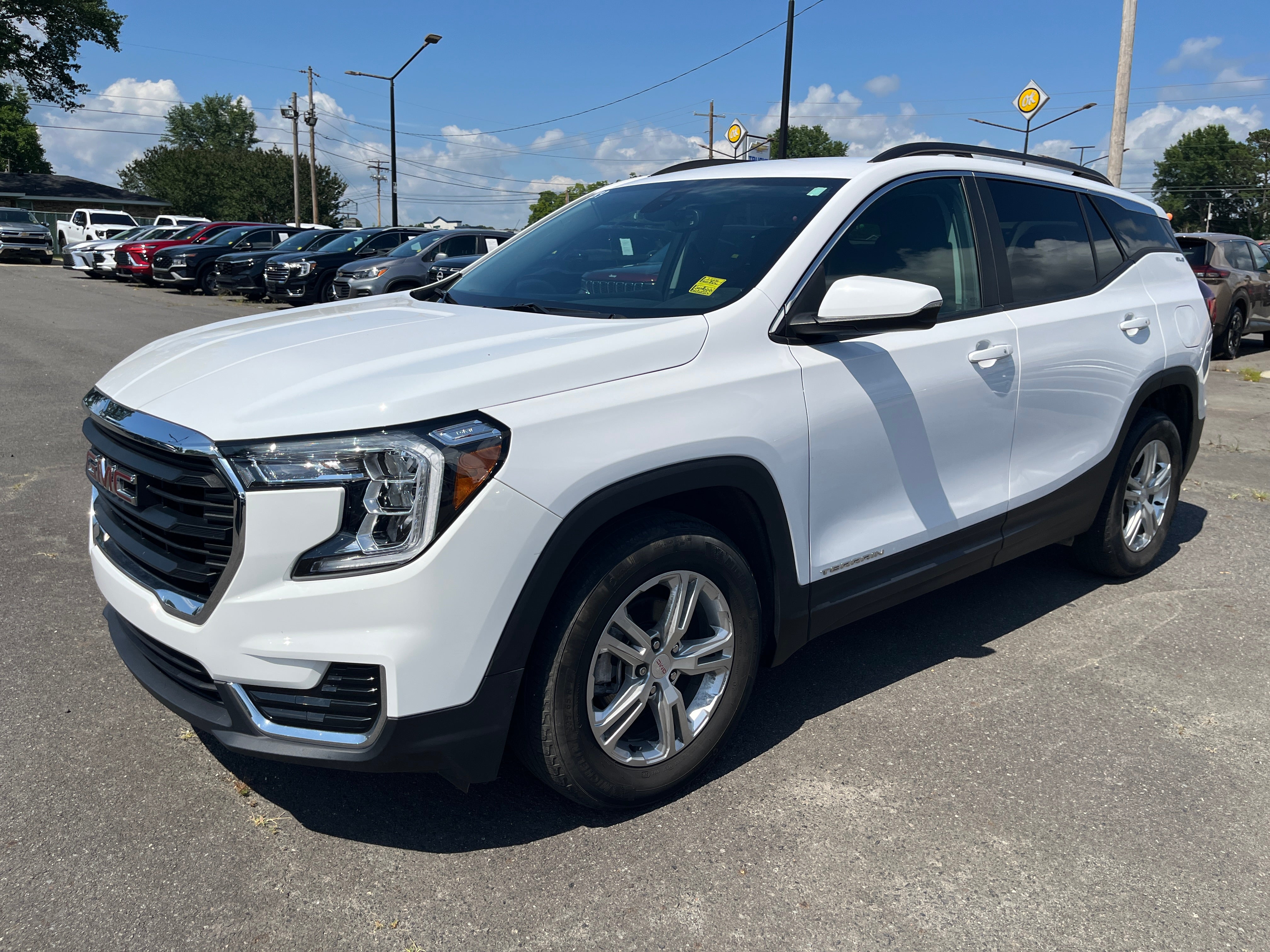 2024 GMC Terrain SLE in Summit White — front three-quarter view