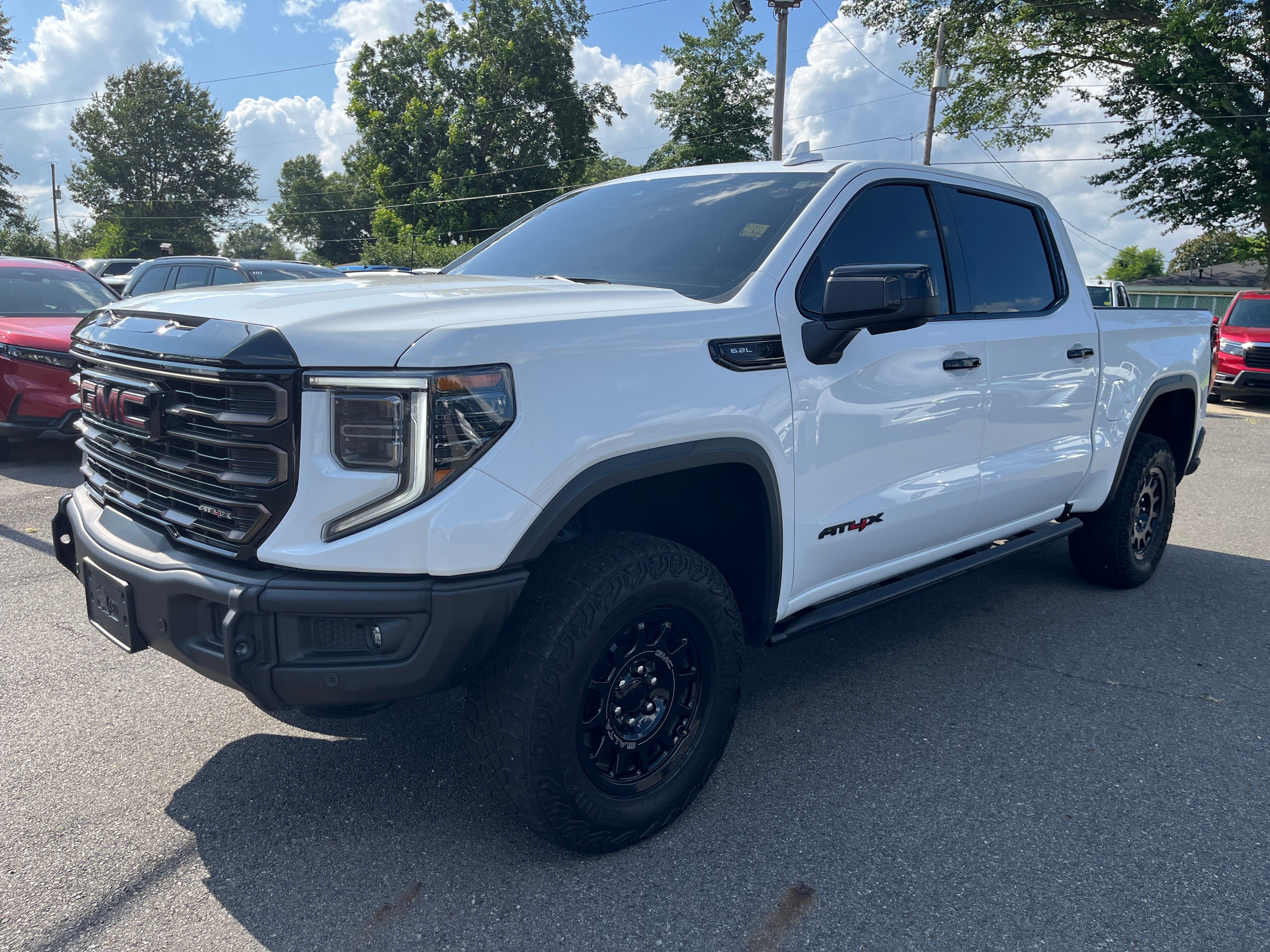 2025 GMC Sierra 1500 AT4X in Summit White — front three-quarter view