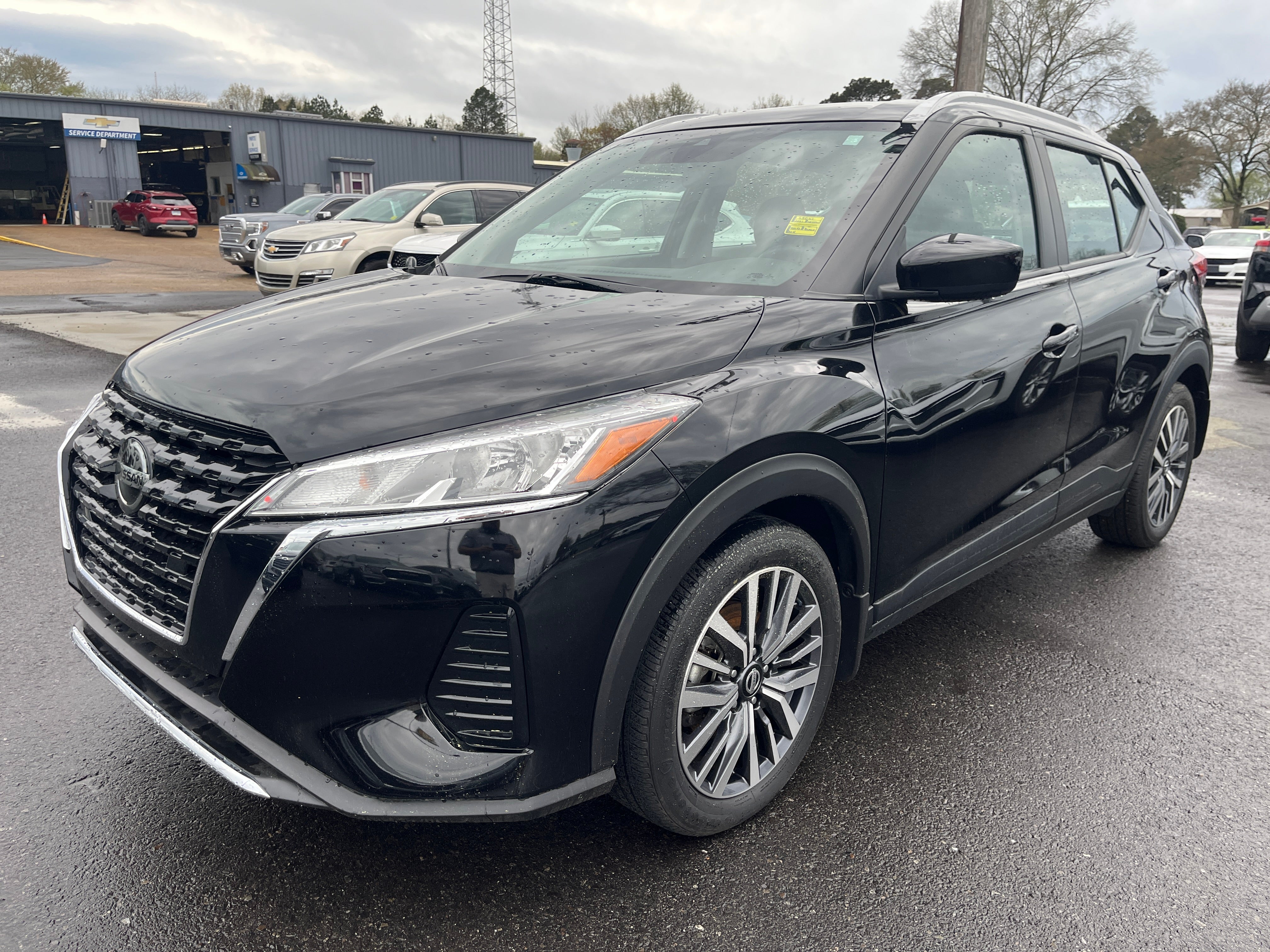2021 Nissan Kicks SV in Black — front three-quarter view