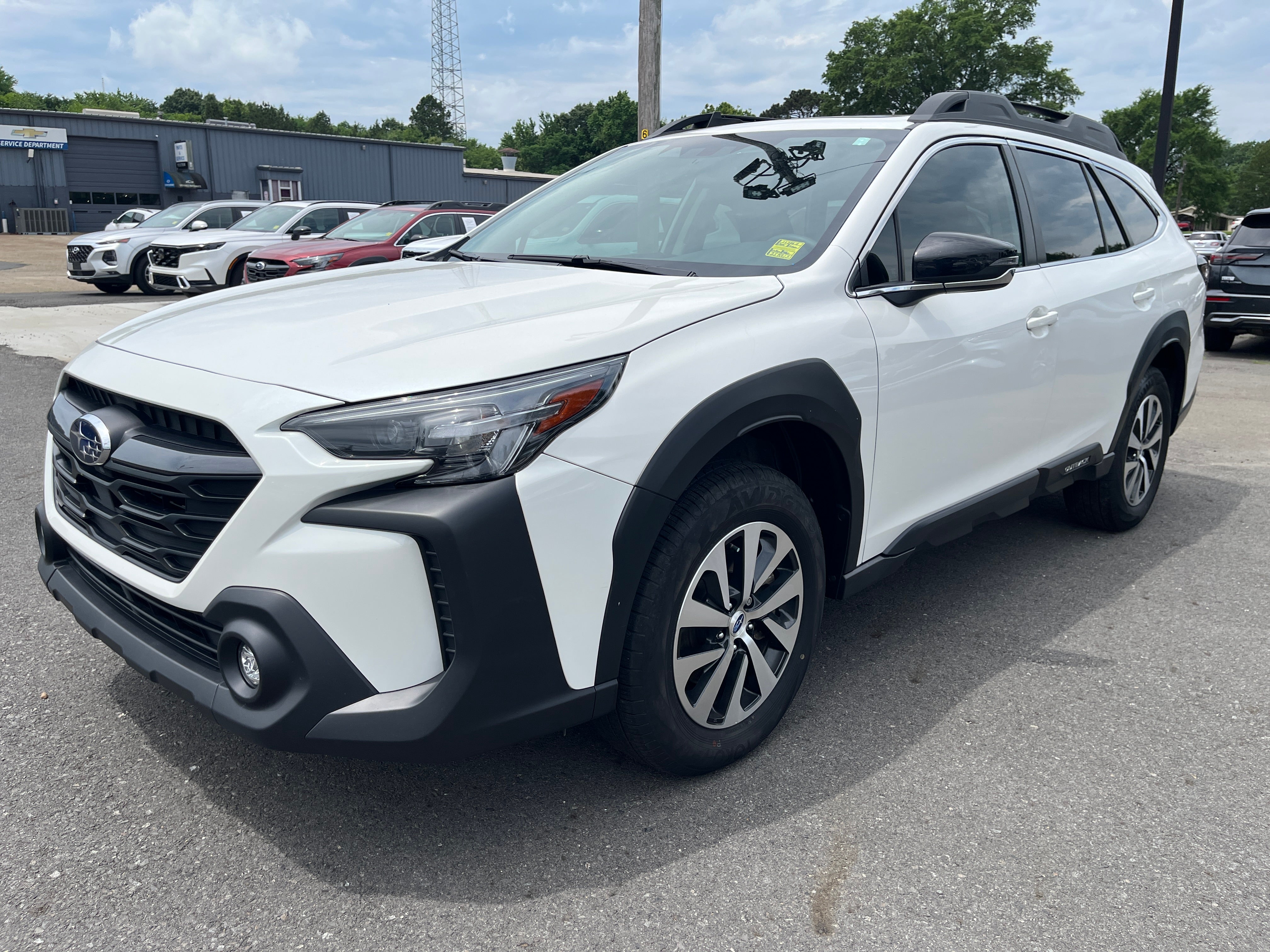 2025 Subaru Outback Premium in White — front three-quarter view