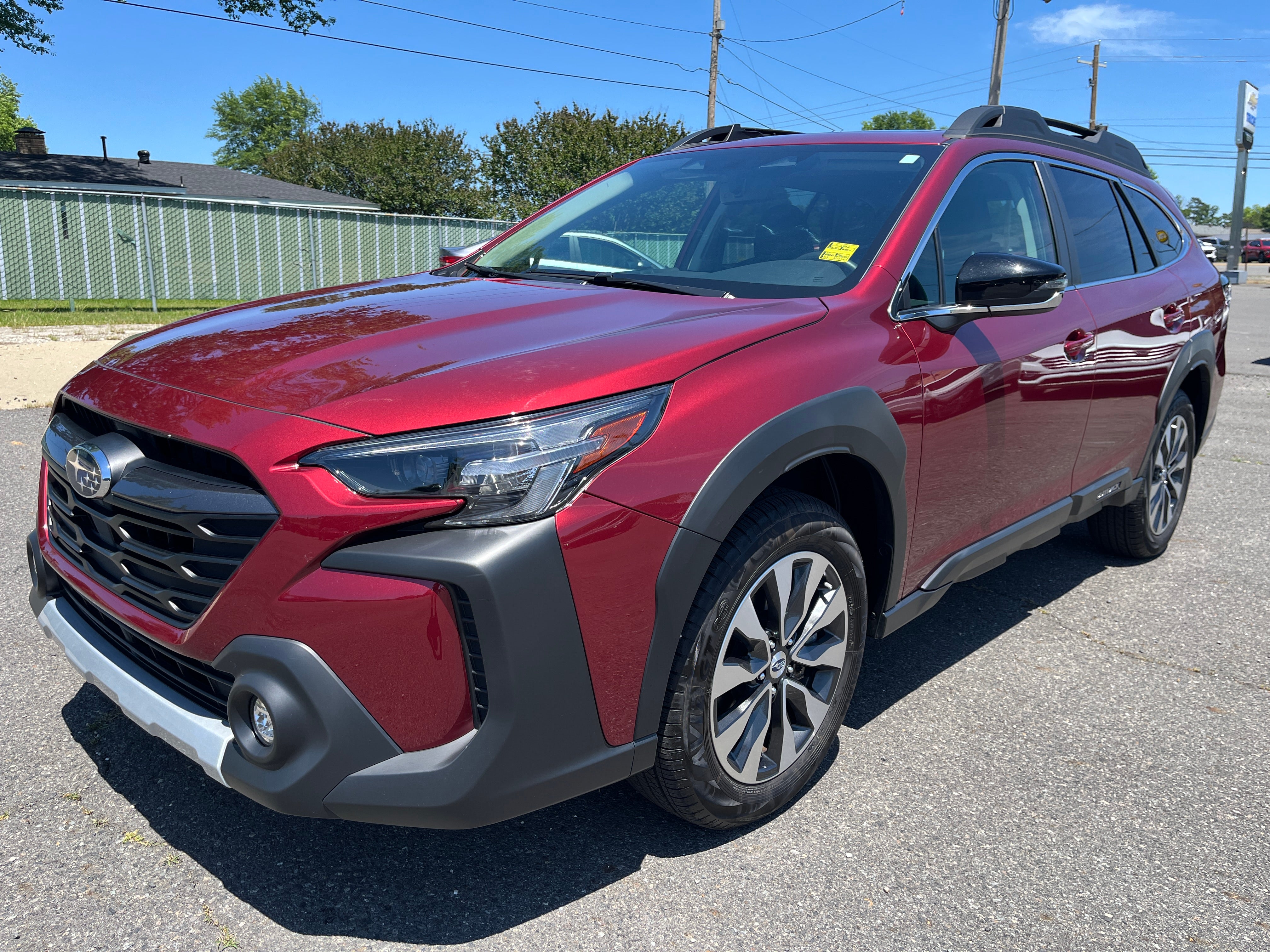 2025 Subaru Outback Limited XT in Red — front three-quarter view