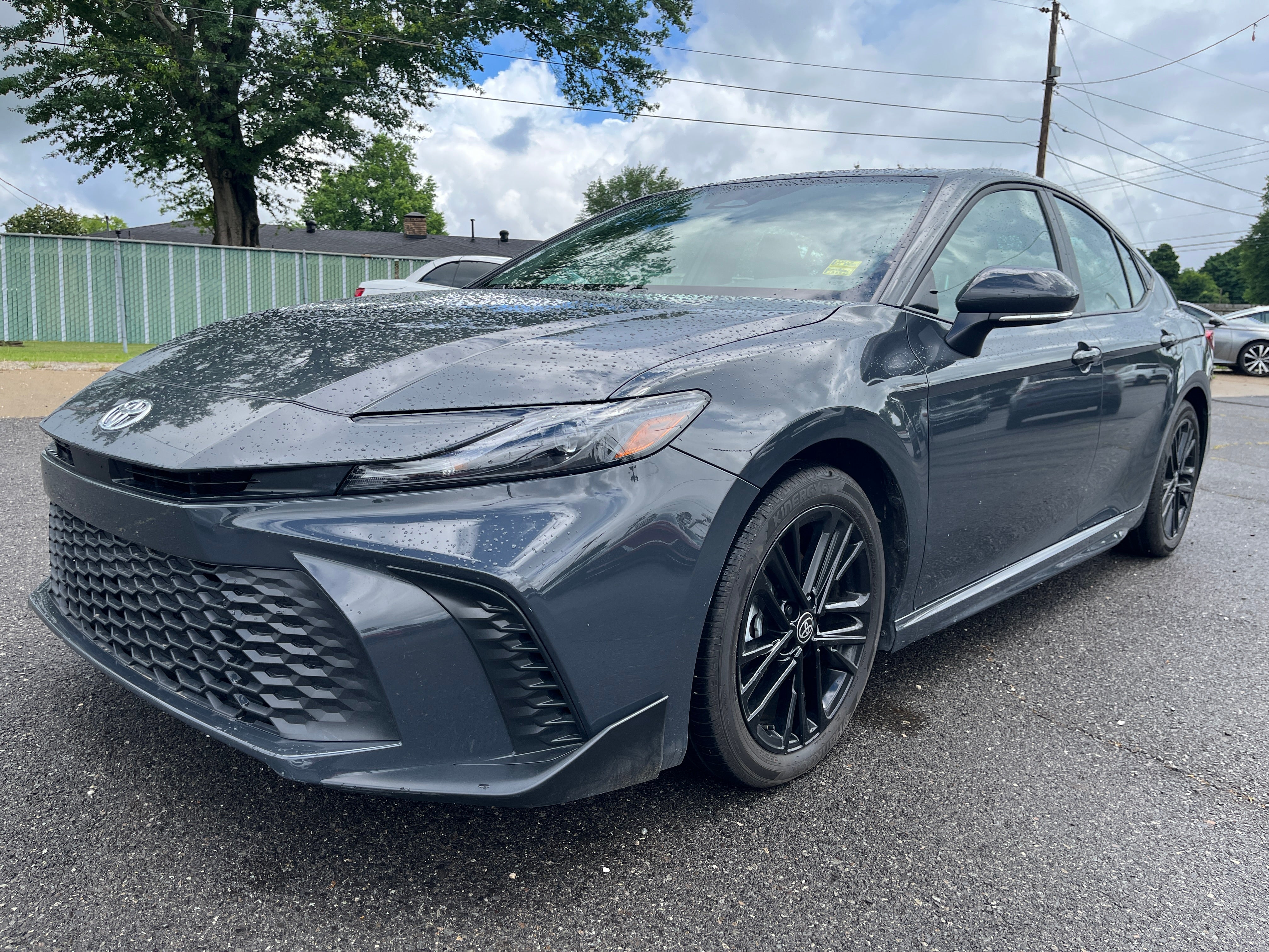 2026 Toyota Camry LE in Gray — front three-quarter view