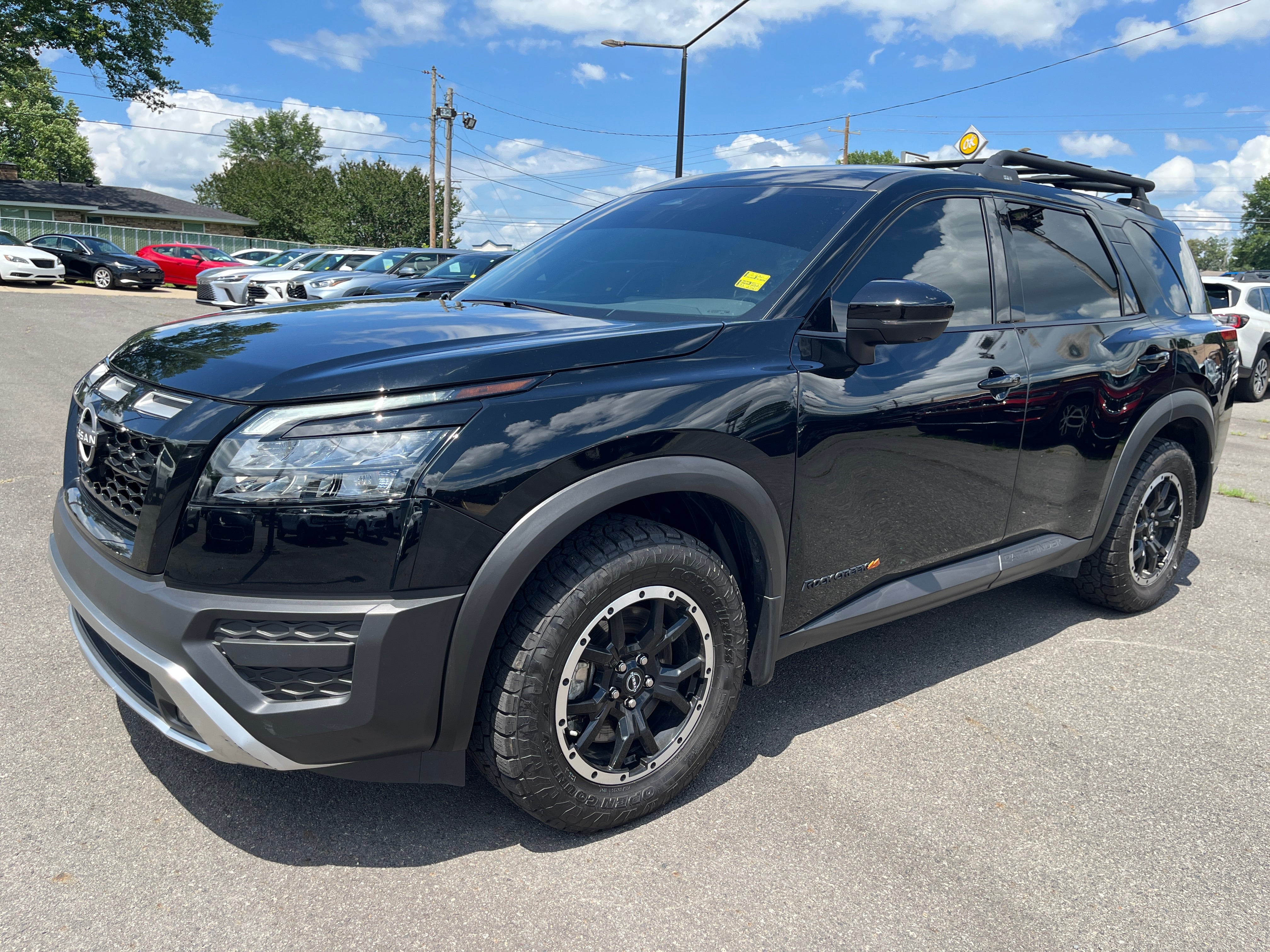 2025 Nissan Pathfinder Rock Creek in Super Blac — front three-quarter view