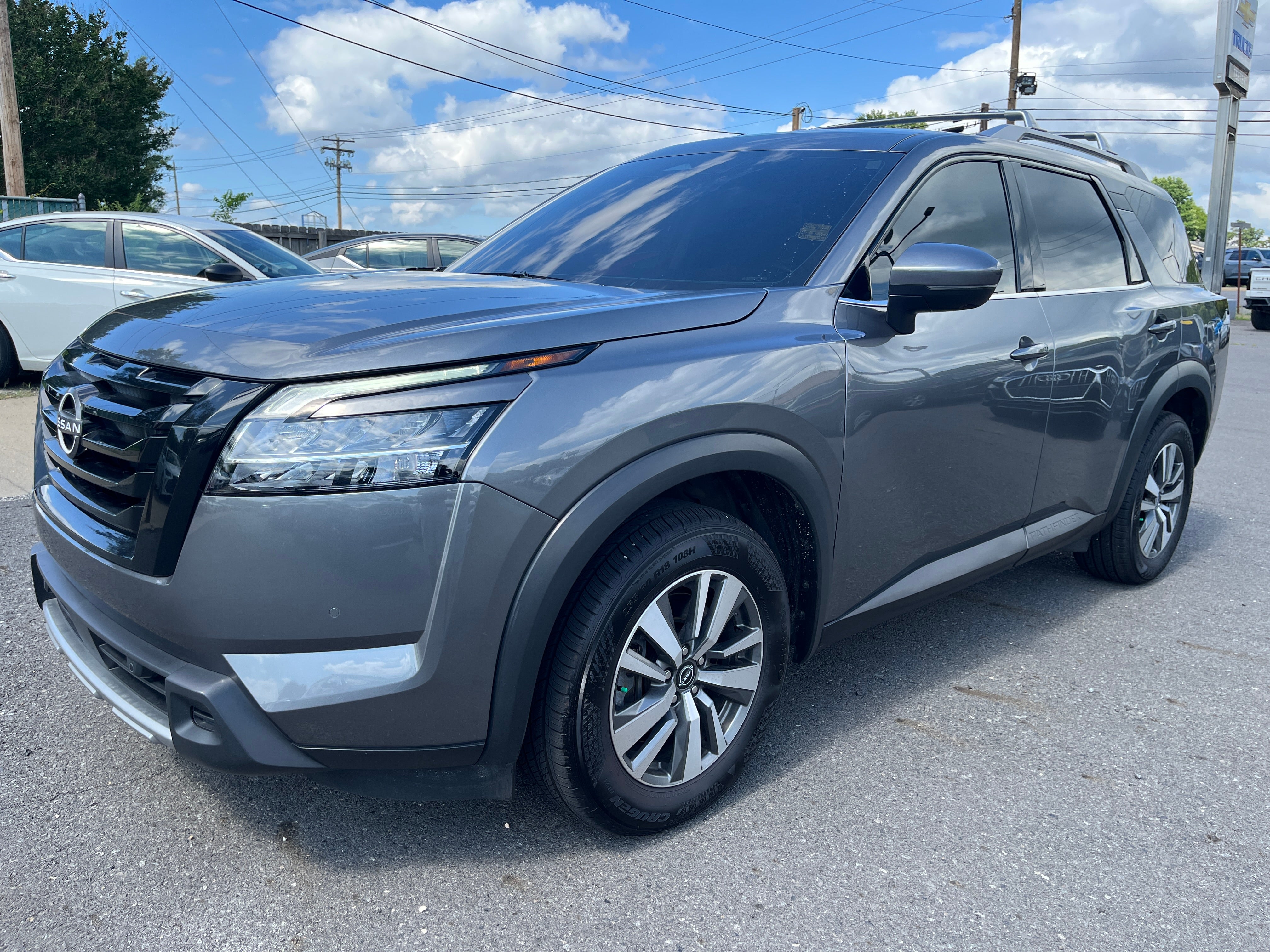 2023 Nissan Pathfinder SL in Gun Metall — front three-quarter view