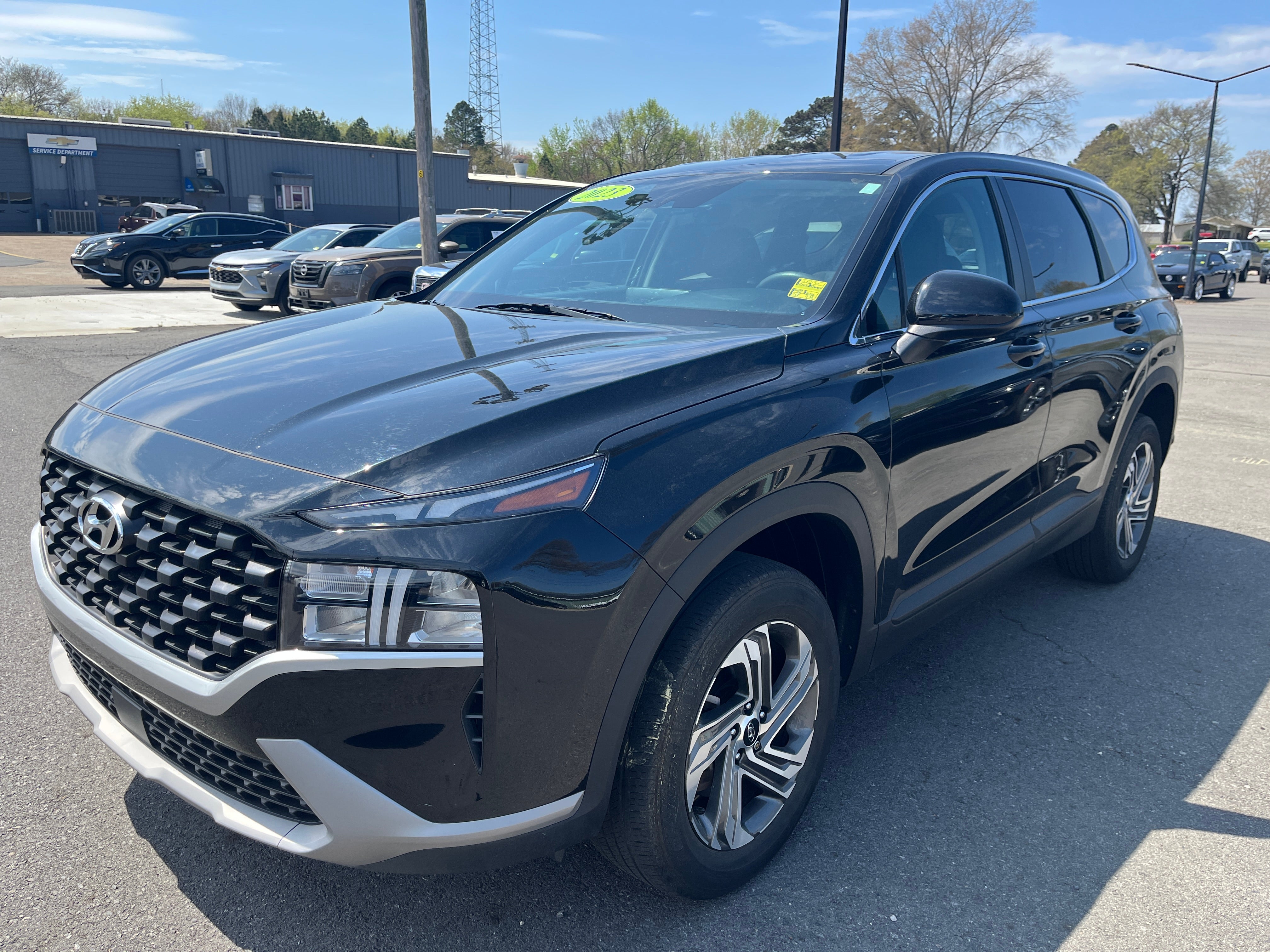 2023 Hyundai Santa Fe SE in Black — front three-quarter view
