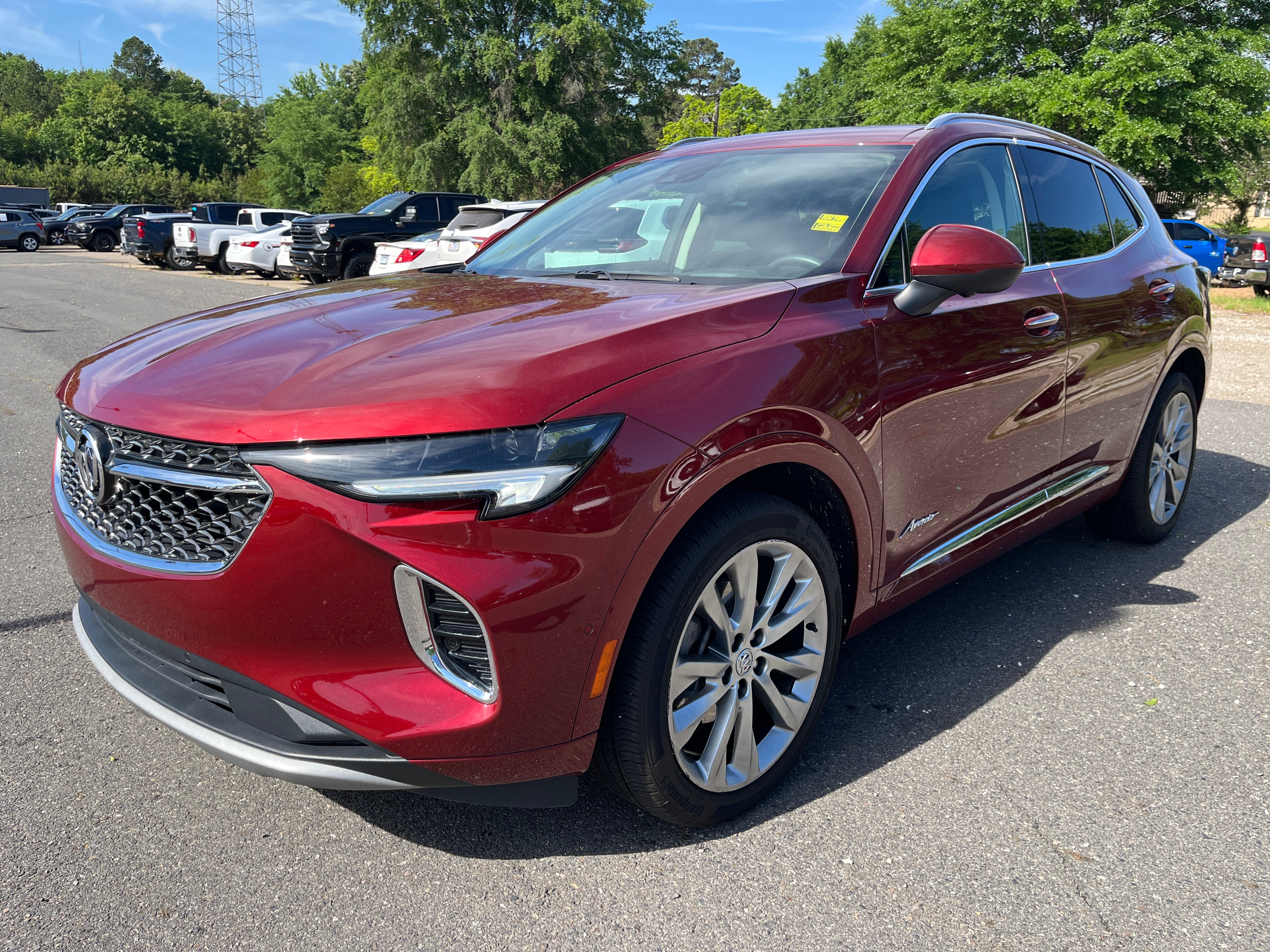 2023 Buick Envision Avenir in Cinnabar Metallic — front three-quarter view
